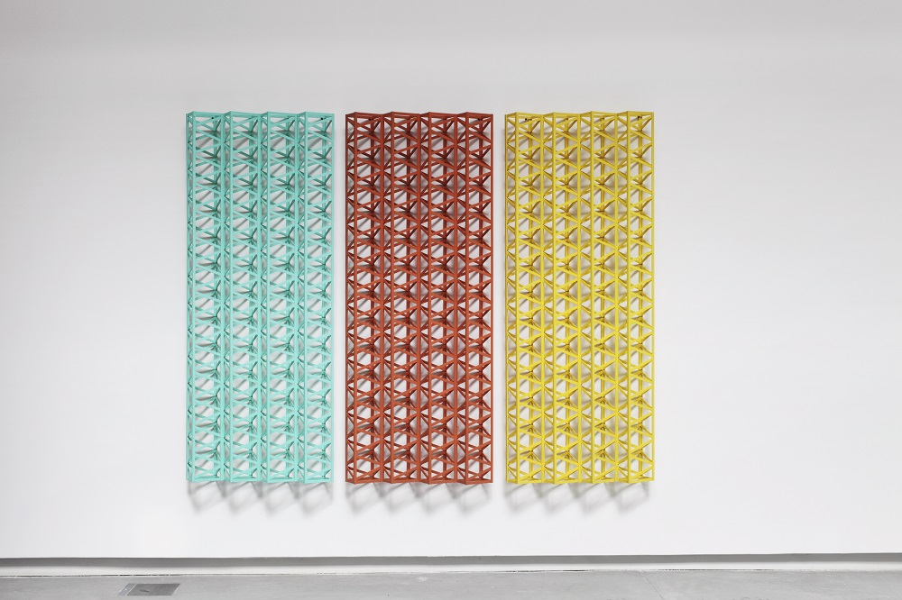 A piece of modern art hung in a gallery, the piece is Sharbati, 1973-2013, by Rasheed Araeen.